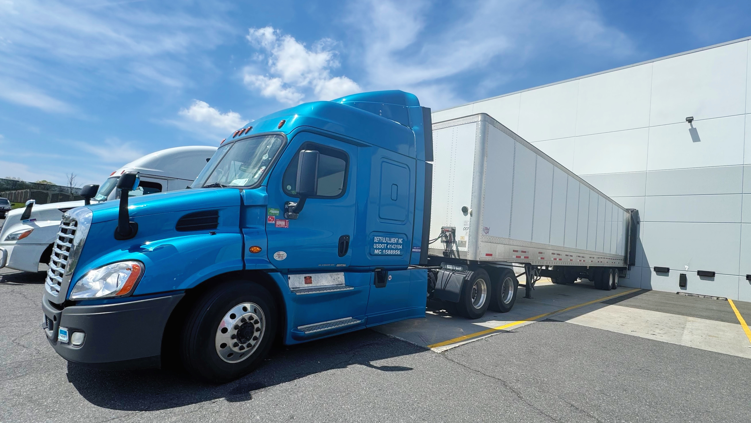 Deftfulfillment truck fleet at the dock